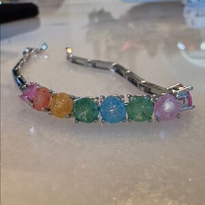 New Bracelet
White gold plated links multi-colored gumdrop stones 7” # G22